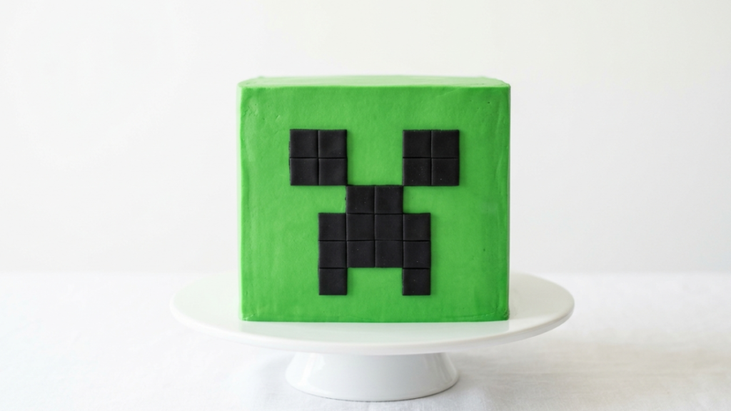 minecraft creeper cake with green square base and black pixel face design