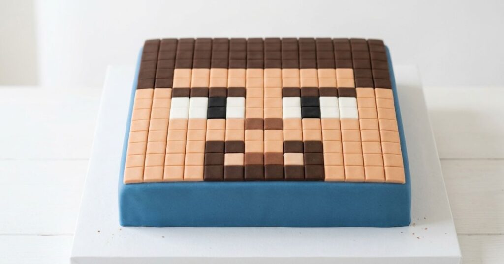 minecraft Steve face birthday cake fondant pixel squares skin tone peach brown hair white black eyes square cake character
